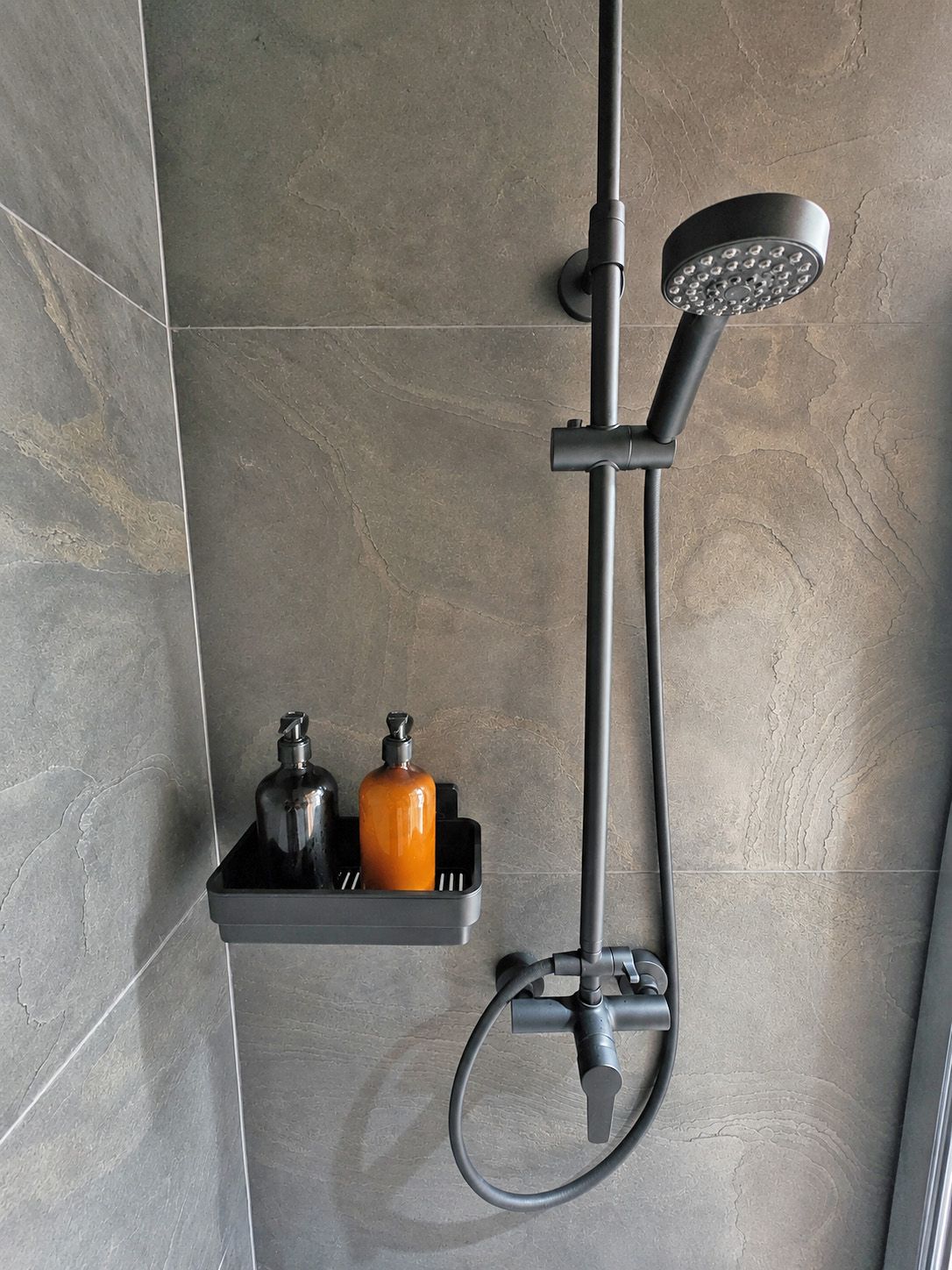 Walk-in shower with hot water from a spring-fed supply
