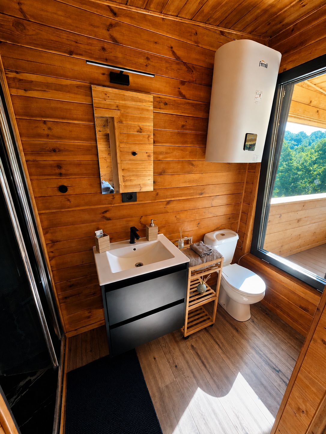 The bathroom, with a window that looks straight out over the forest