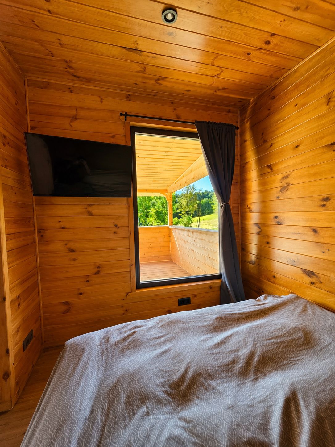 The bed nook, with a window opening onto the terrace