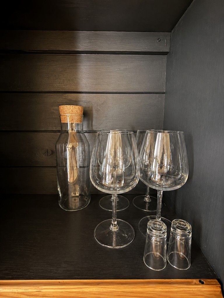 Wine glasses and a carafe provided in the kitchenette