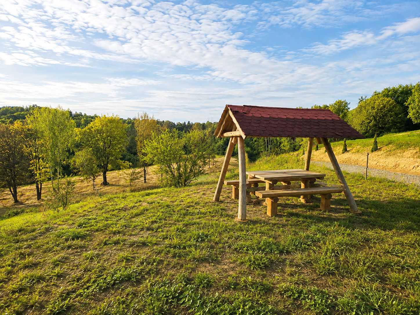 The covered picnic shelter in the meadow, overlooking the hills