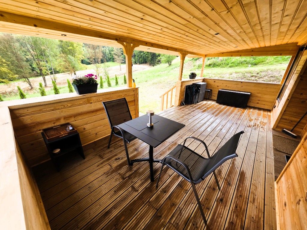 The covered terrace seating area, dry and comfortable even on a rainy day